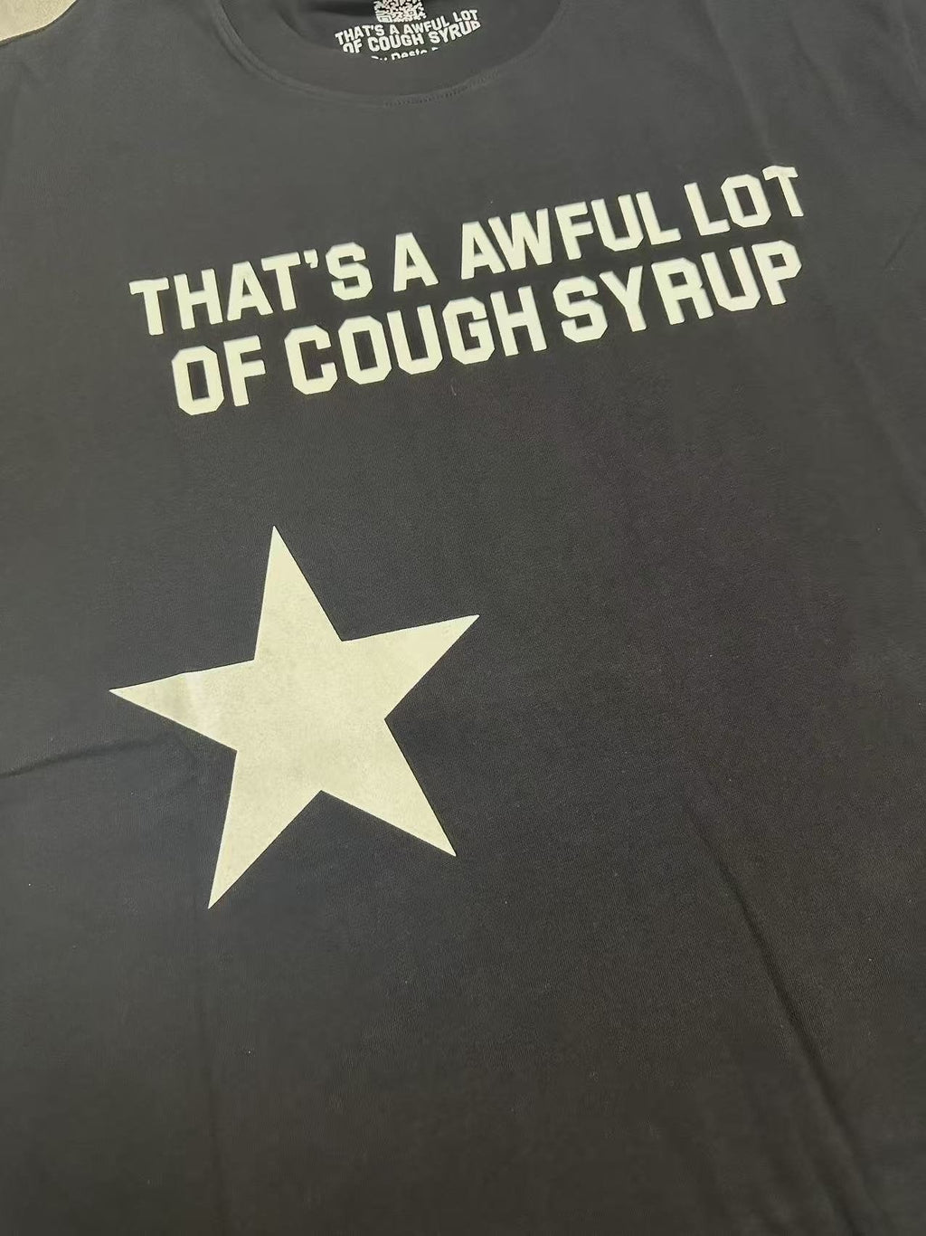 THAT'S A AWFUL LOT OF COUGH SYRUP Star Graphic Short-Sleeve T-Shirt ¡ª detail