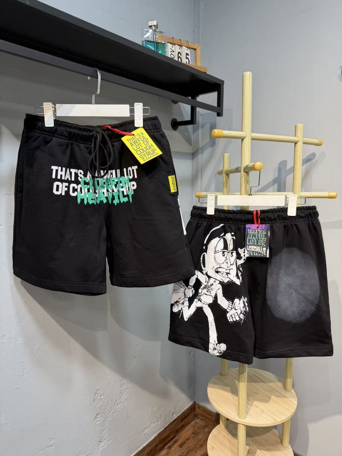 THAT'S A AWFUL LOT OF COUGH SYRUP Cartoon Back Graphic Shorts ¡ª front