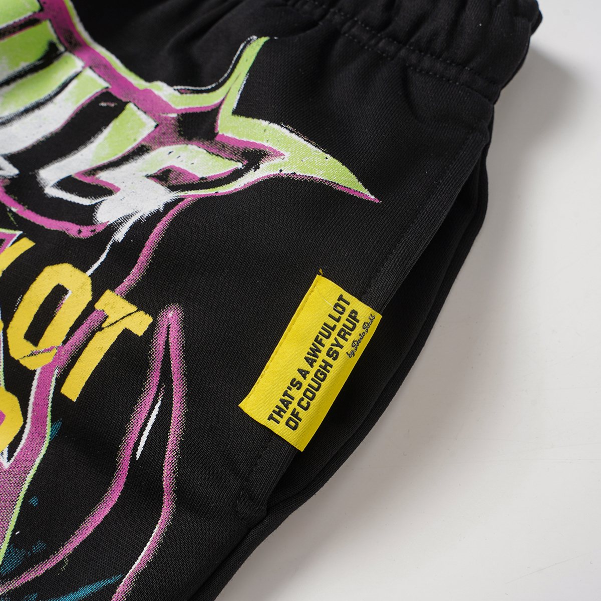 THAT'S A AWFUL LOT OF COUGH SYRUP Black Graphic Drawstring Shorts ¡ª detail
