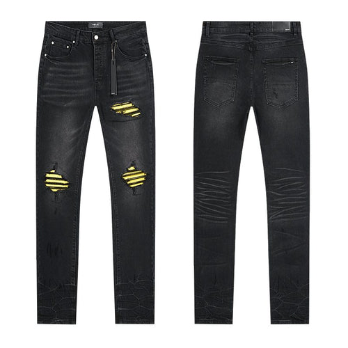 AMIRI Yellow-Backed Distressed Black Jeans ¡ª hero