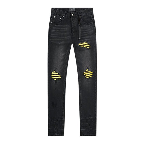 AMIRI Yellow-Backed Distressed Black Jeans ¡ª front