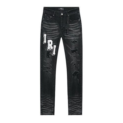 AMIRI Varsity Letter Appliqu¨¦ Distressed Jeans ¡ª front